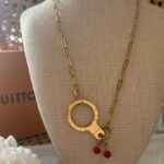 Reworked L V Engraved Keyring / Cherry Reworked Necklace